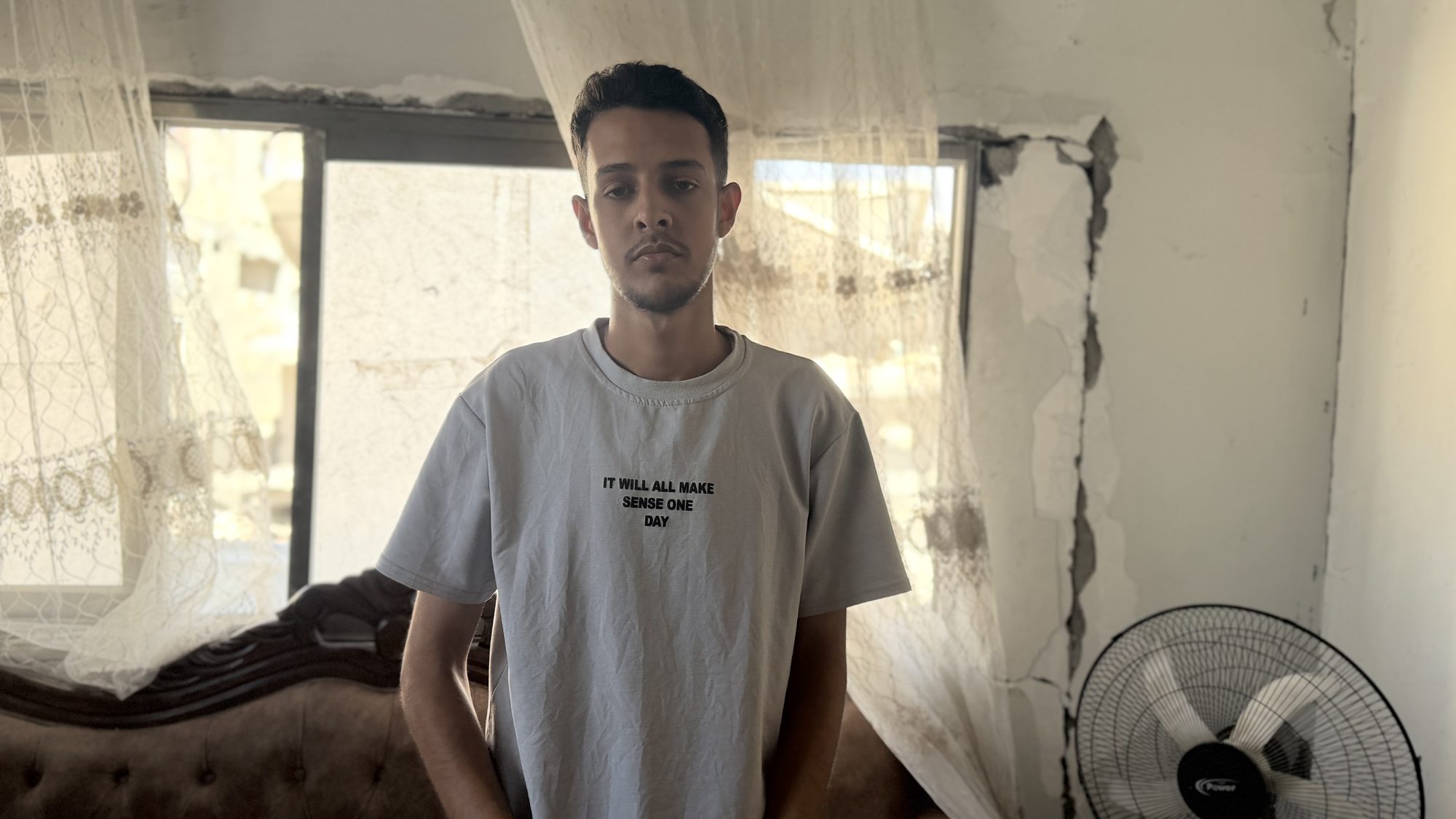 Ahed al-Ghalban standing in a room at home