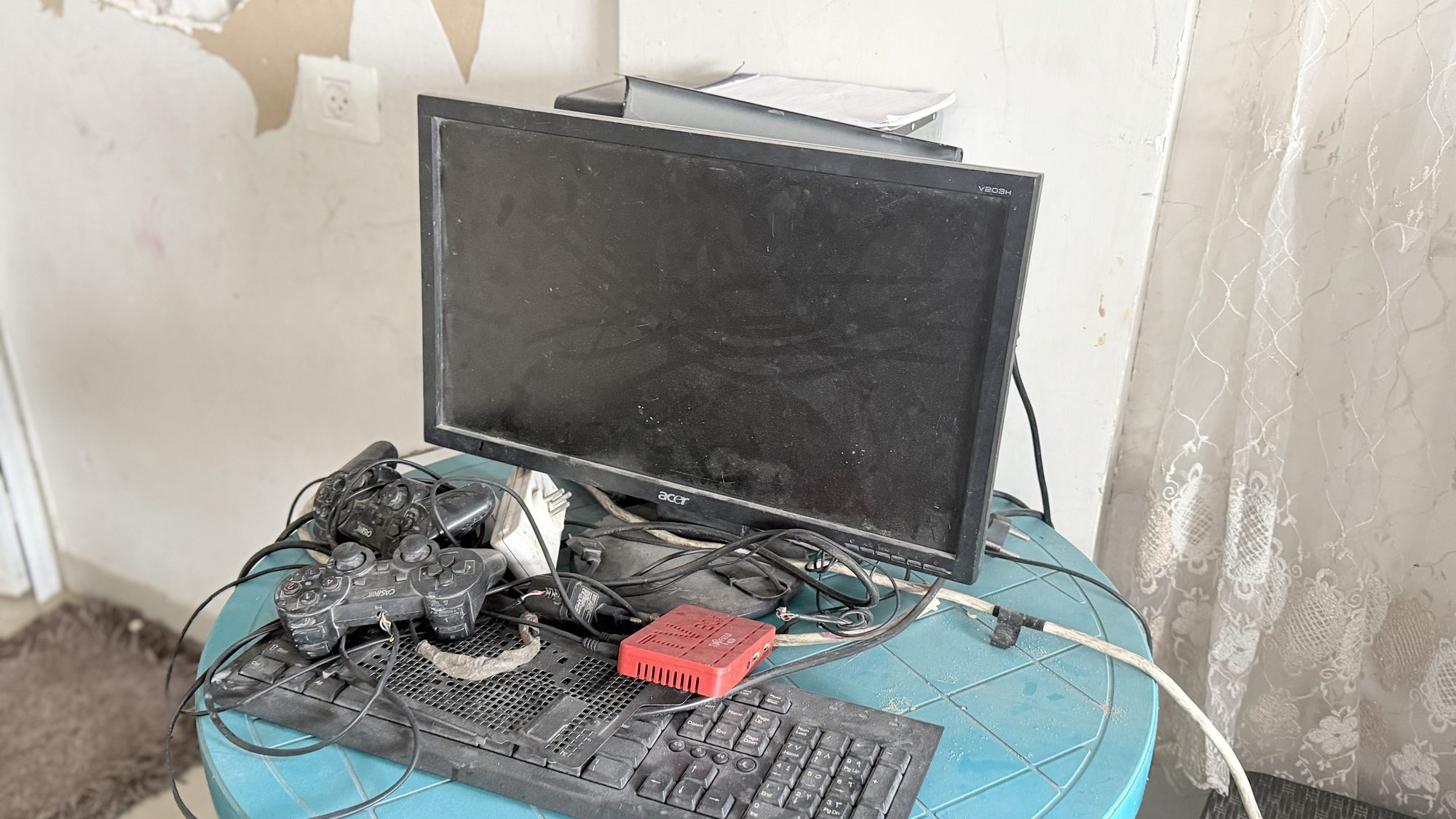 A laptop and monitor on a small desk